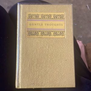 Like new in plastic book cover